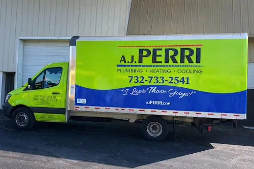 A.J. Perri box truck in Red Bank, NJ, featuring plumbing, heating, and cooling services, with phone number 732-733-2541.